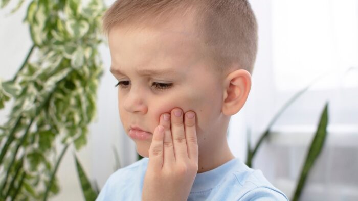 3 Important Things To Do In A Dental Emergency boy with sore tooth